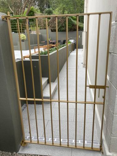 Gate 051 - Gold pedestrian gate on terrace